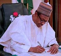 President Muhammadu Buhari signing a document